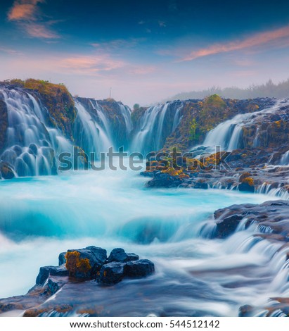 Summer sunset with unique waterfall - Bruarfoss. Colorful evening scene in South Iceland, Europe. Artistic style post processed photo.