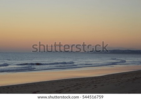 Sunset in the Beach with Multicolored Sky on the Ocean
