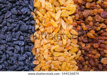 assortment of raisins background, texture Royalty-Free Stock Photo #544536874