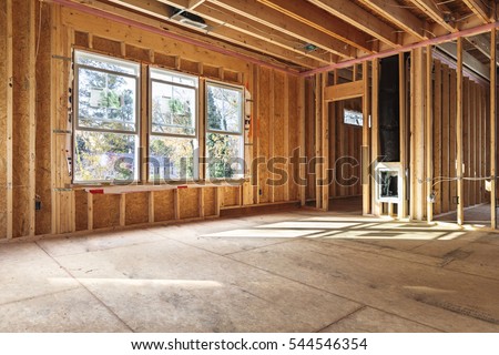 interior frame of a new house under construction in North Carolina. Royalty-Free Stock Photo #544546354