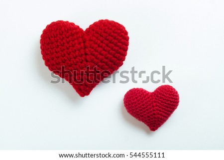 Crochet hearts on white background. Valentine's Day. Symbol of love. 