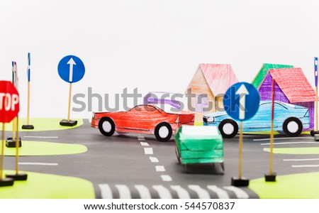 Paper model of busy crossings in toy city