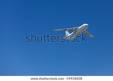 Big airplane in a clear blue sky, room for copy.