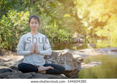 asian woman Yoga - relax in nature