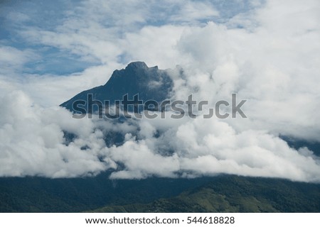 Mount Kinabalu with morning cloud mist. Mount Kinabalu in Sabah Malaysia is one of UNESCO World Heritage site in South East Asia.
