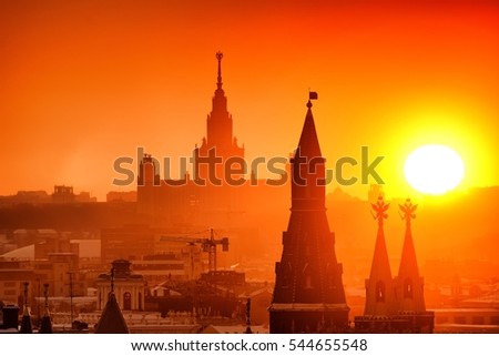 Moscow city historical skyline winter aerial sunset view snow building street kremlin tower red square historical museum main university skyscrapers residential building roof russian winter background