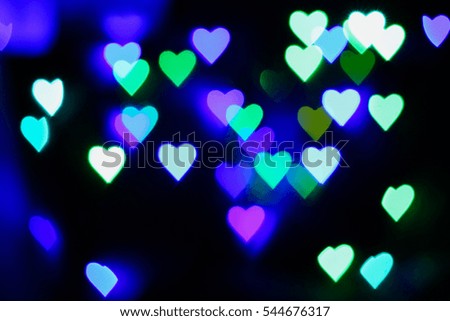 Defocused blurred heart shaped lights. St. Valentines Day background