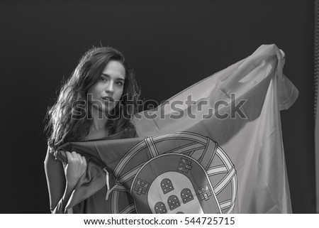 Beautiful brunette woman with Flag of Portugal. 