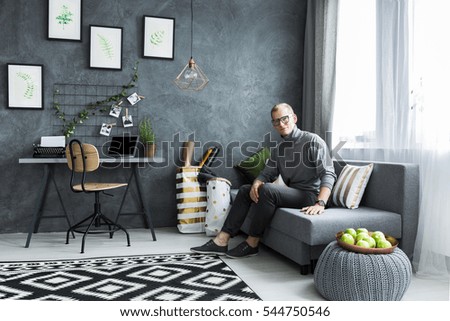 Hipster in his modern and multifunctional flat