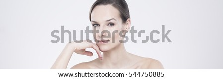 Panoramic portrait of a beautiful young woman with natural make-up