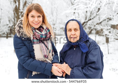 Picture of a sick old woman with her loving grandchild
