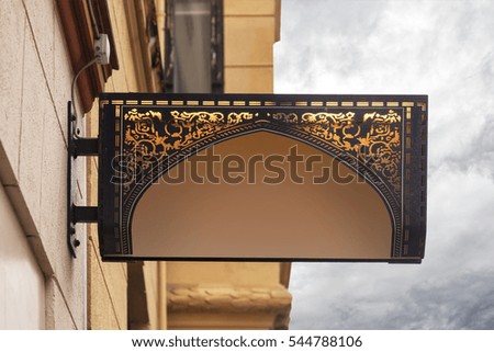 Image of ornate building street sign. 