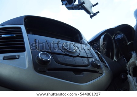 Car dashboard, inside a car.
