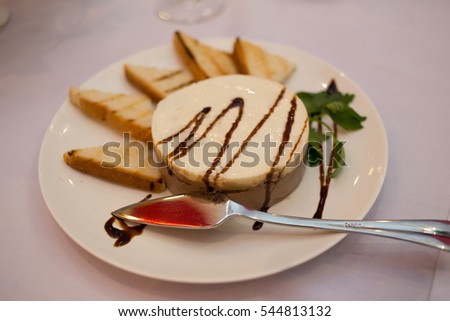 pate with toast on a plate in a restaurant