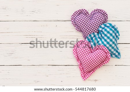 Love background, romantic hearts on white wood with copy space.