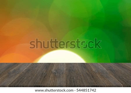 Abstract bokeh background of light for celebration new year and christmas with wood terrace