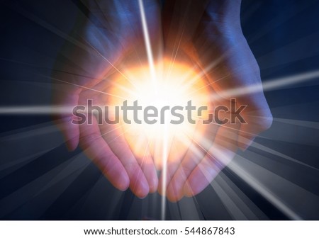 Light in hand. Royalty-Free Stock Photo #544867843