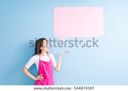 beauty housewife take speech bubble billboard and smile isolated on blue background