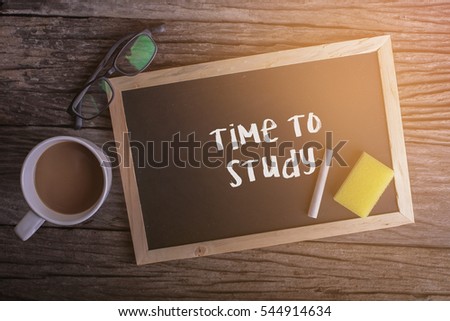 Time To Study  On blackboard with cup of coffee, with glasses on wooden background