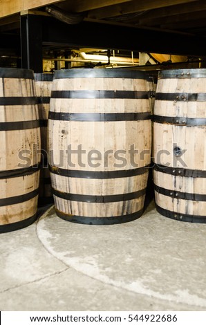 Bourbon barrels tucked away before being plugged for aging Royalty-Free Stock Photo #544922686