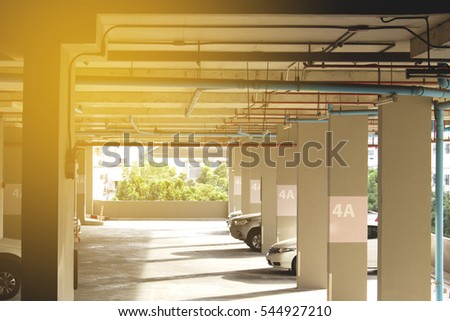car park in condominium and water pipe with warm light
