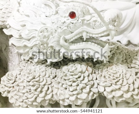 White Dragon head stucco, bas-relief