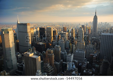 New York City Manhattan skyline aerial view with Empire State and skyscrapers at sunset.