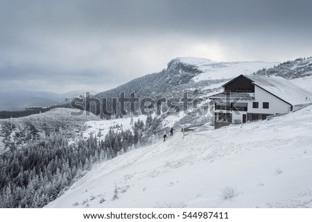 Mysterious winter landscape majestic mountains in winter. Mountain chalet. Carpathian. Romania. Europe