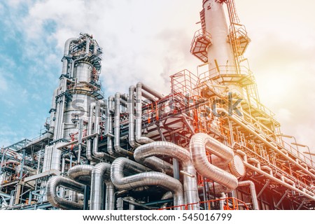 Industrial zone,The equipment of oil refining,Close-up of industrial pipelines of an oil-refinery plant,Detail of oil pipeline with valves in large oil refinery. Royalty-Free Stock Photo #545016799