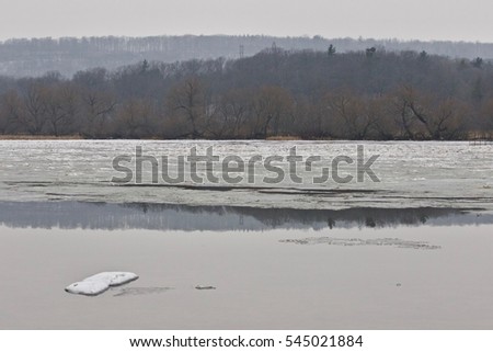 Beautiful background with a lake and forest in the winter time