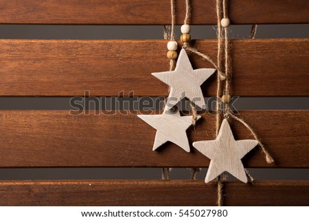 Wooden stars and the rope on the table.