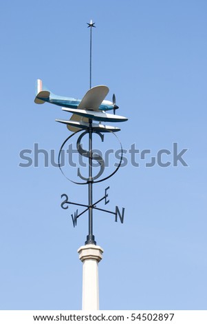 Weather vane with a model aircraft.