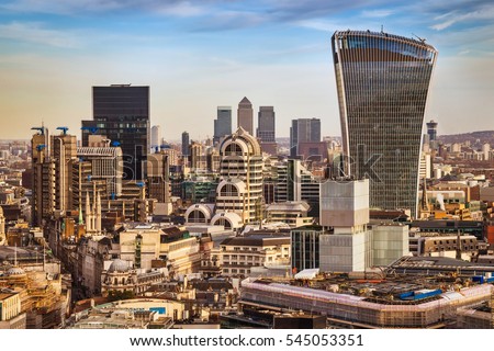 London, England - Bank district and Canary Wharf, the two leading financial districts of the world in central London with famous skyscrapers and other landmarks at golden hour