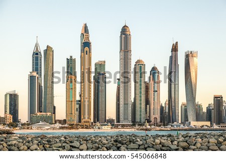 An overview of buildings in Dubai Marina as seen from Dubai Palm Jumeira. Royalty-Free Stock Photo #545066848