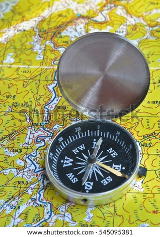Map with compass. Necessary navigational tools, they will not get lost.