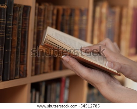 hands holding reading books