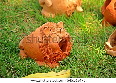 Decorative clay doll in the garden