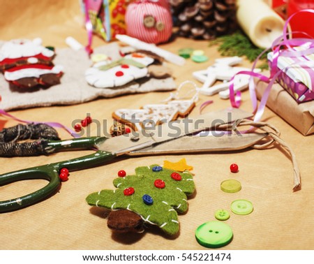 lot of stuff for handmade gifts, scissors, ribbon, paper with countryside pattern, ready for holiday concept, nobody home 