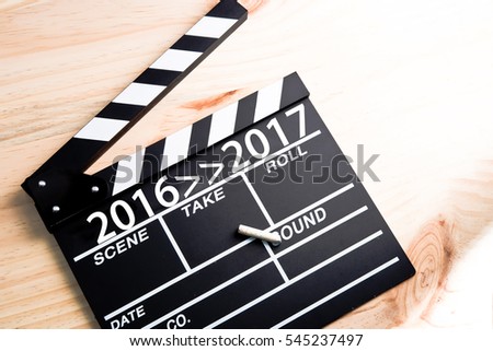 Clapper board on wood countdown to next year with text 2016 to 2017