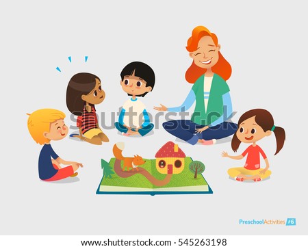 Female teacher tells fairy tales using pop-up book, children sit on floor in circle and listen to her. Preschool activities and early childhood education. Vector illustration for poster, website. Royalty-Free Stock Photo #545263198