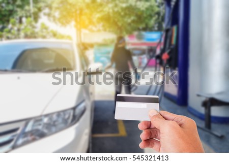 Credit card to make a payment for refueling car on gas station
