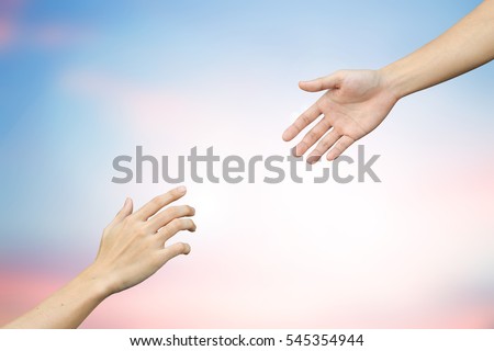 close up helping and blessing pray hands on blur beautiful sunrise sky background for empower life and friend support and human rights of equality concept  Royalty-Free Stock Photo #545354944