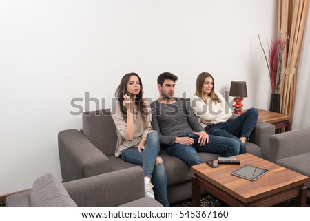 group of friends enjoying at modern home indoors