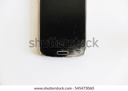 Mobile phone screen is cracked on white background