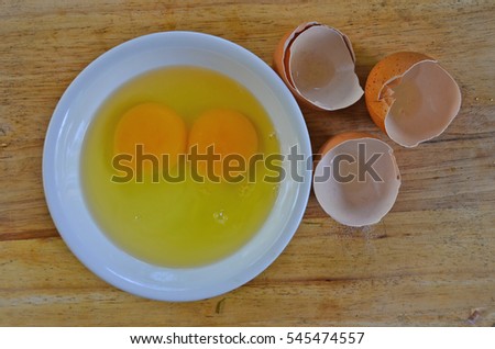 Fresh yolk and albumen with opened shells