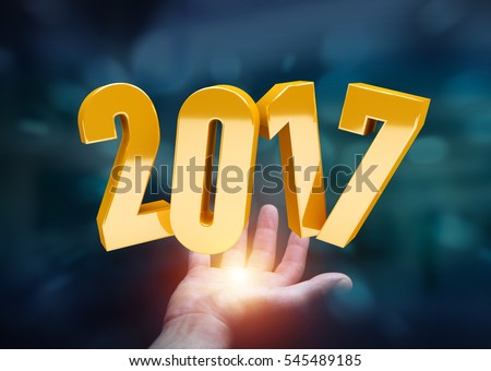 Businessman holding colorful 2017 3D rendering text in his hand