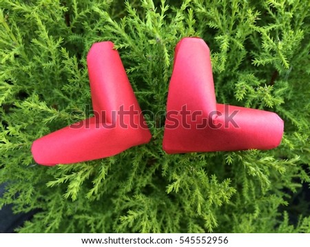 Two Paper Red hearts hanging on Green Branch trees Nature Background. You can use for greeting card (Happy Valentines Day)