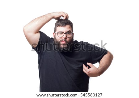Fat young man making a gesture imitating a monkey isolated on white background