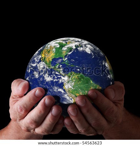 Hands holding world with north and south america. Earth image courtesy of NASA