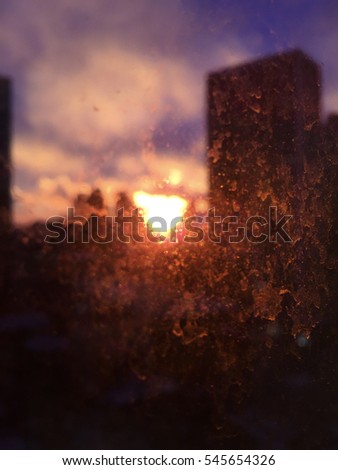 Sunset through a dirty New York City office window - abstract background
